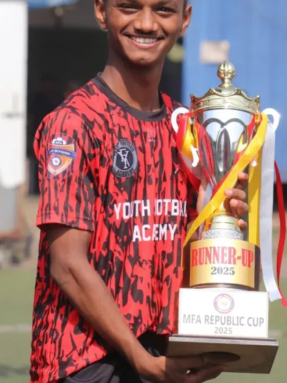 A smile of pride. This player holds our hard-earned runner-up trophy from the MFA Republic Cup 2025, showcasing the spirit of our academy.