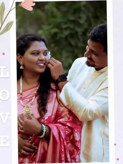 A tender moment during a traditional Maharashtrian pre-wedding shoot. He gently places a flower behind her ear, highlighting their connection against a natural backdrop.