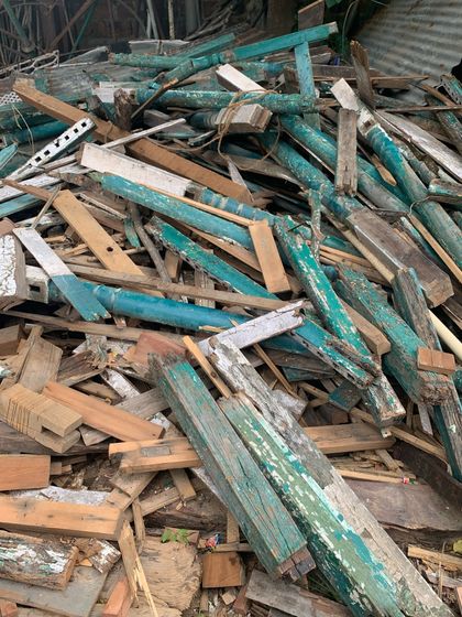 A pile of salvaged timber from the old balcony. Our principle of circularity means we reuse and recycle as much of the original material as possible.