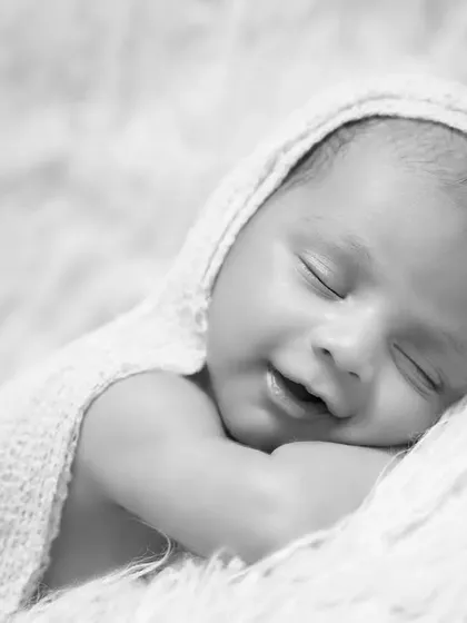A simple, classic black and white portrait of a sleeping newborn. Sometimes, removing color brings out the pure emotion and peacefulness of the moment.