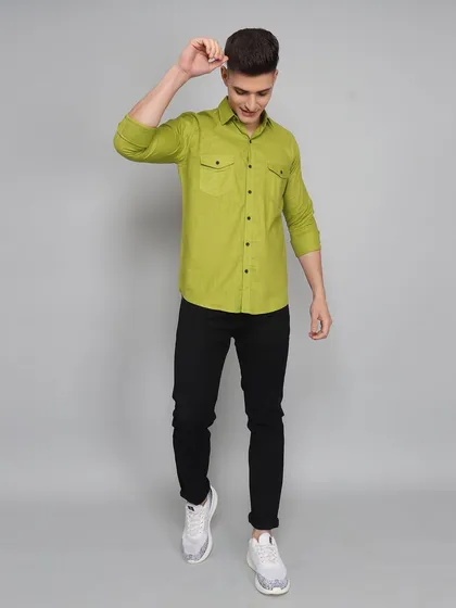 A full-length dynamic pose of a model in a casual shirt and jeans. Action poses can make apparel look more appealing and less static than standard studio shots.