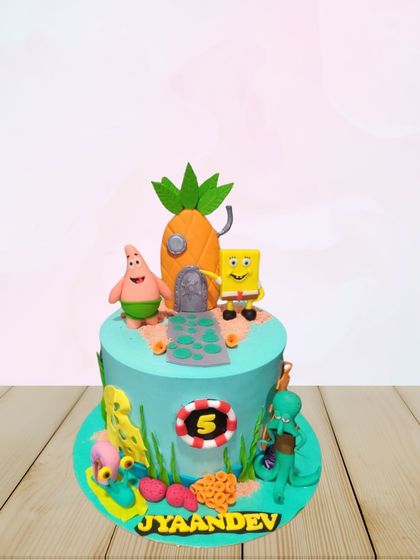 A single-tier version of the SpongeBob theme, featuring his pineapple house under the sea. This cake includes SpongeBob, Patrick, and Squidward, perfect for a smaller celebration.