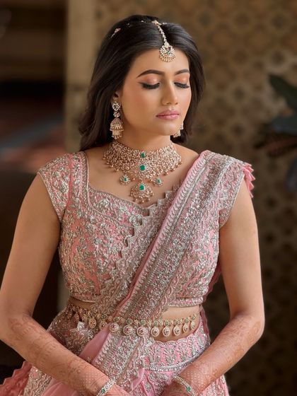 An eyes-closed portrait to highlight the soft, blended eyeshadow and the flawless finish of her makeup.