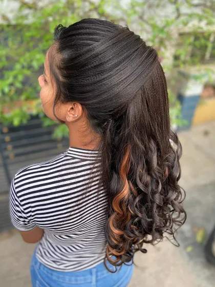 A side view of the advanced ponytail, showing the beautiful crimped texture and the flow of the curls.