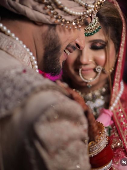A heartwarming, candid moment between the bride and groom. Her soft smokey eye and gentle smile are captured beautifully in this shot.
