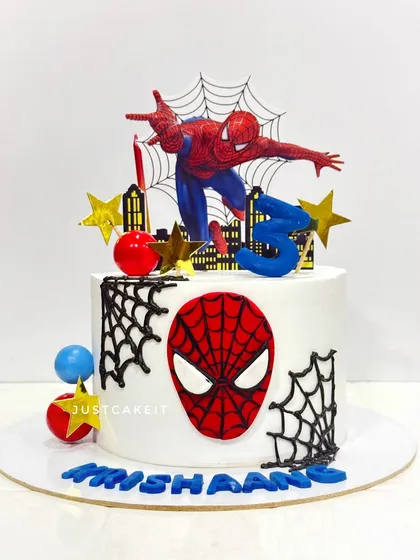 A simple Spiderman cake with a hand-painted mask and web details. This design is perfect for a smaller celebration.