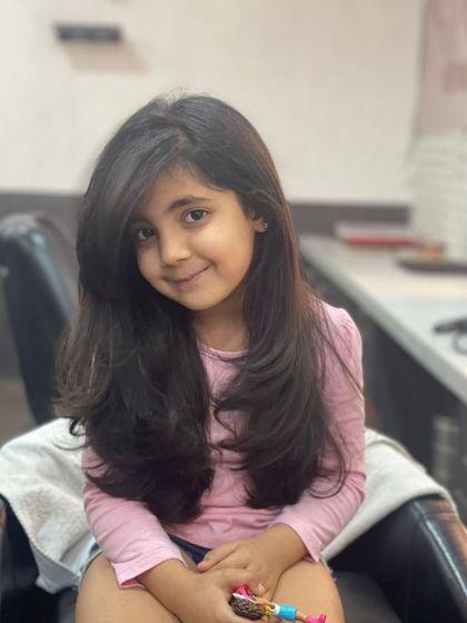 This sweet client is all smiles after her new haircut. I gave her long, flowing layers that add shape to her hair without sacrificing length.