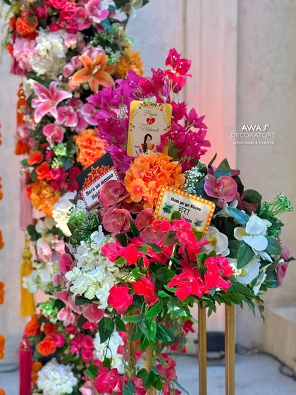 A beautiful floral arrangement with fun, quirky signs, adding a personalized and playful touch to the decor.