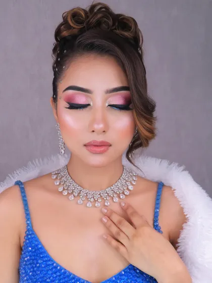 Another pose showcasing the beautiful party makeup and hairstyle, demonstrating a complete and polished look.