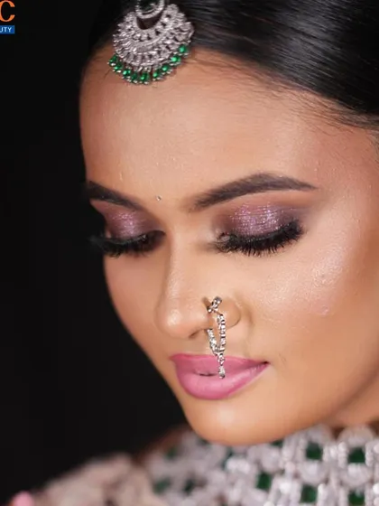 Another angle of the purple eyeshadow look, showing the expert blending and lash work.
