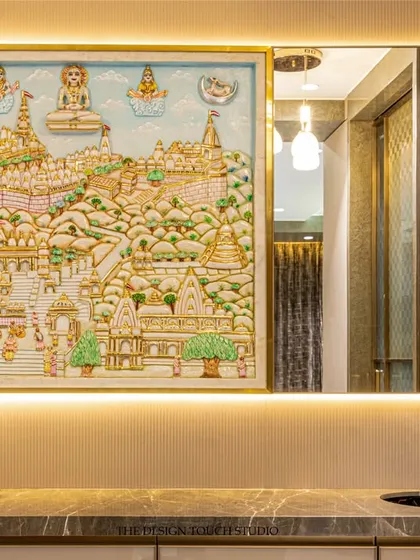 A close-up of the backlit traditional Indian painting, which acts as a vibrant focal point in the dining area. We love incorporating personal and meaningful art into our designs.