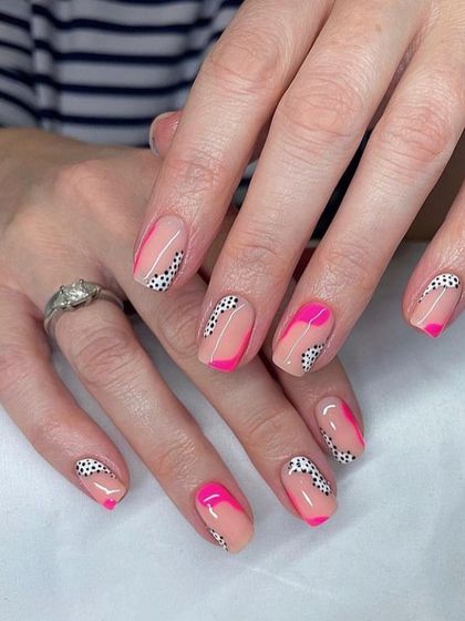 A modern and graphic design combining hot pink color blocks with a black and white polka dot pattern. It's a bold, playful, and stylish choice.