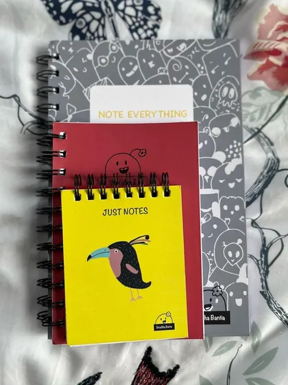 My notebooks come in all shapes and sizes! From A5 spiral-bounds for all your big ideas to tiny pocket notepads for thoughts on the go, each one has a quirky doodle on the cover to make you smile.