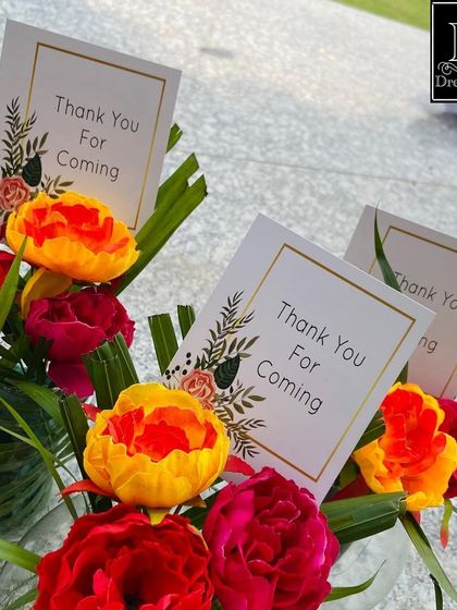 Thoughtful party favors for the retirement celebration. Small floral bouquets with "Thank You For Coming" cards are a lovely way to show appreciation to the guests.