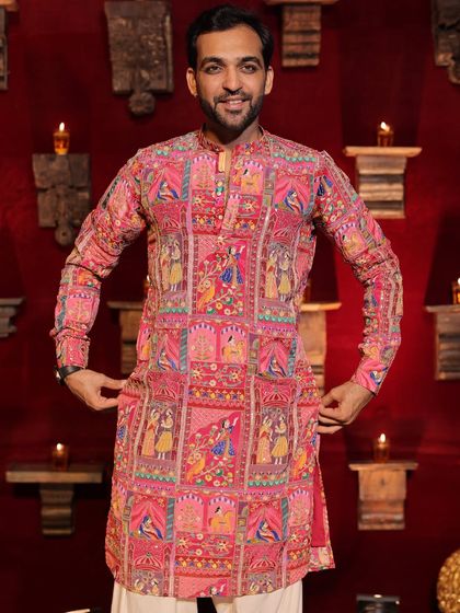 Getting ready to take the stage at a Garba event. The detailed embroidery on this kurta reflects the rich cultural heritage of the Navratri festival.