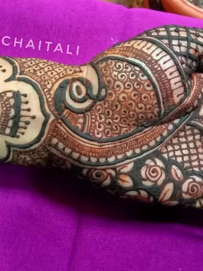 A traditional design featuring hanging jhumki motifs. This style is perfect for festive occasions and for family members attending a wedding.