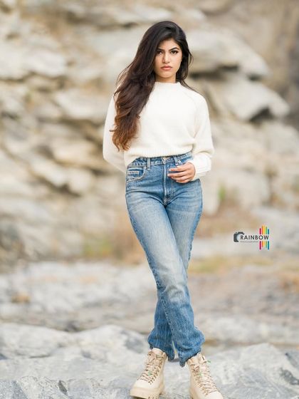 A confident, full-body pose that highlights a classic winter fashion look.