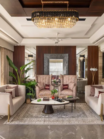 A full view of the living room, where a large mirror and warm wooden interiors create a refined and sophisticated look.