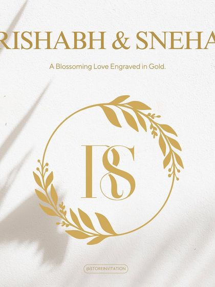A beautiful monogram designed for Rishabh and Sneha. The initials 'R' and 'S' are gracefully intertwined within a golden wreath of leaves, symbolizing a love that is natural, growing, and blossoming.