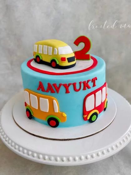 The wheels on the bus go round and round! A simple and fun cake for a toddler's birthday, featuring colorful buses and a handmade bus topper. It’s a theme that little ones always adore.