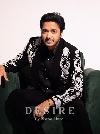 Confidence, tailored. Here, actor Shreyas Talpade wears a bespoke ceremonial jacket I designed. The sharp, modern fit is contrasted with powerful white embroidery on a classic black base, creating a look of pure, unapologetic elegance.