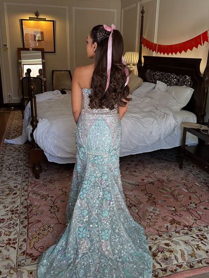 The full look, with the client's whimsical hairstyle perfectly matching her dreamy, embellished gown.
