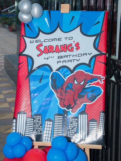 The excitement starts at the entrance. A custom "Welcome" sign sets the tone for the superhero adventure waiting inside.