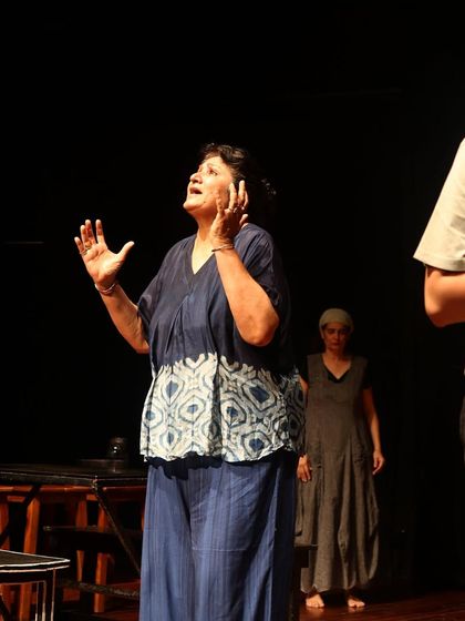An actor fully immersed in her character during a rehearsal for "The House of Bernarda Alba," demonstrating the emotional depth of the performance.