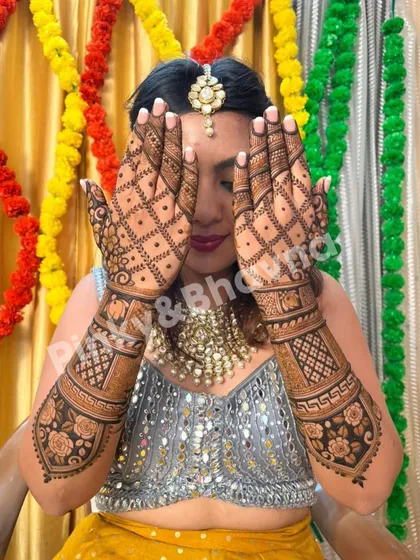 A classic bridal pose, with the bride peeking through her beautifully decorated hands. The grid and floral patterns are perfect for a wedding.