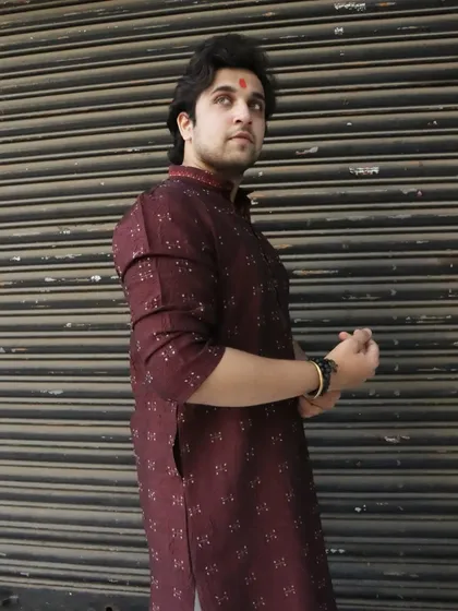 Celebrating Gudi Padwa in a traditional maroon kurta. This look is perfect for print or digital campaigns centered around Hindu new year festivities.