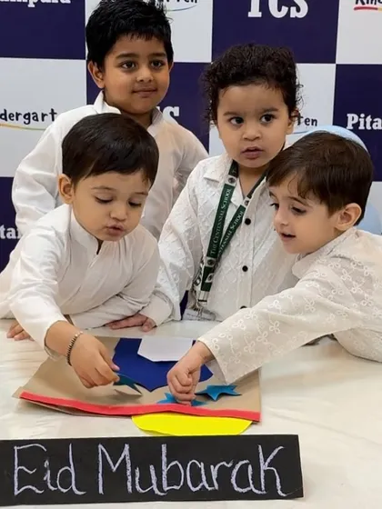 A group of friends collaborating on their Eid craft. Our parties are all about learning, creating, and having fun together.