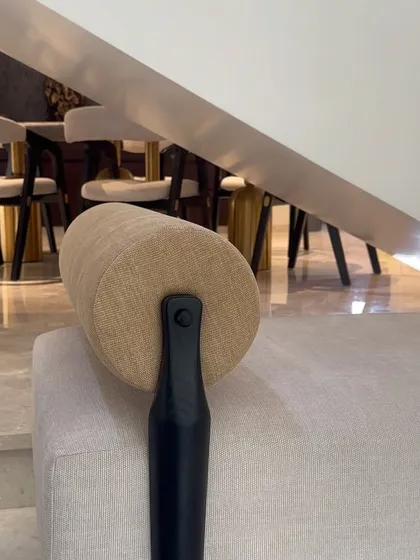 This angle highlights the clean lines and joinery of the daybed's teak frame, where the leg meets the cylindrical bolster, showcasing the attention to detail in my work.