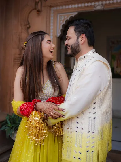 The joy of the Haldi ceremony is in the shared laughter. We capture the playful and intimate moments between the couple, like this one from Sanchit and Shriya's celebration.
