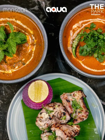 A comforting meal of creamy curries and succulent malai chicken tikka, showcasing the rich flavors of our Indian menu.