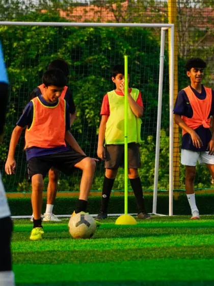 Here, we focus on the fundamentals. This training session shows our young players working on close ball control and dribbling around markers, a key drill to improve their first touch and confidence on the ball.