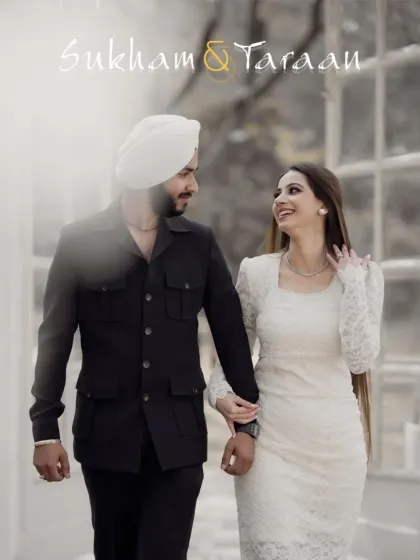 A happy, walking shot of the couple in coordinated white and black outfits. This image feels natural and stylish, capturing their modern love story.
