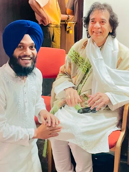 A cherished moment with the god of tabla, Ustad Zakir Hussain ji. His smile and blessings are a source of immense inspiration for me.