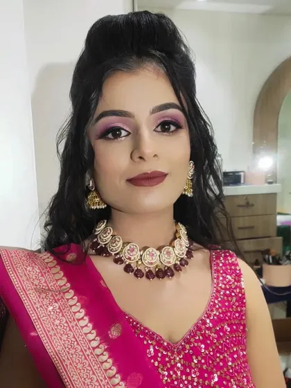 A clear portrait showing the flawless base and sharp eye makeup for this sangeet look.
