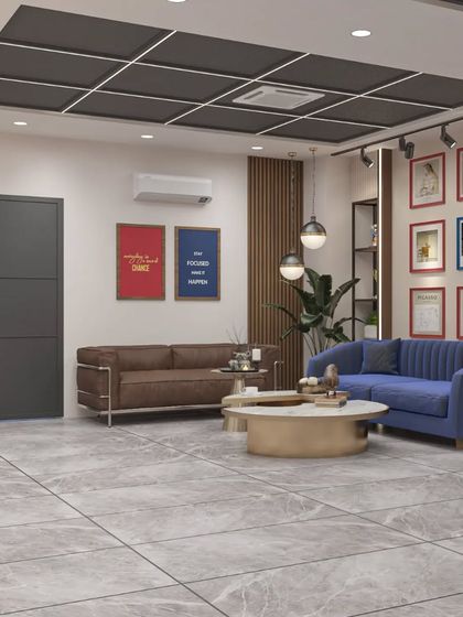 An office waiting lounge that uses a combination of different colored sofas and wall art to create a vibrant and welcoming atmosphere.