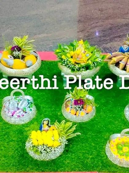 An elegant engagement platter setup with crystal-like baskets and fresh floral arrangements. This style is perfect for modern and sophisticated themes.