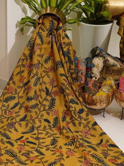 This is a glimpse into my Kalamkari Edition, featuring a wide array of hand-painted dupattas and fabrics from the Indralokam series. Each piece is a unique story, available for you to customize into your dream outfit.