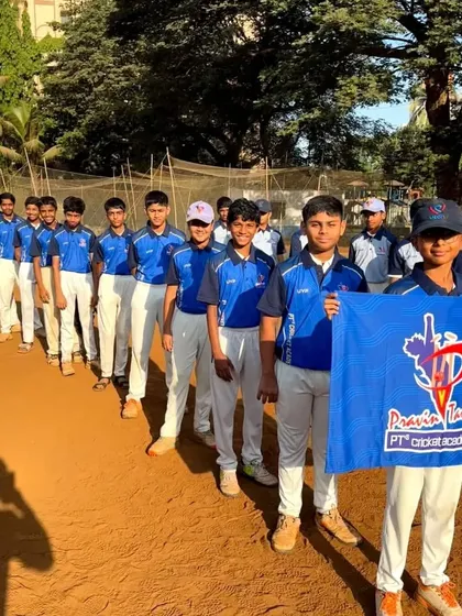 The U-14 Blue Team, presenting their team flag. This pre-tournament parade is a key part of building excitement and team identity.
