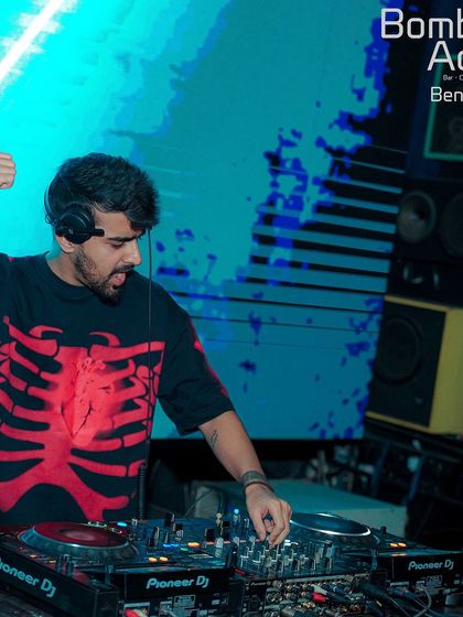 At the decks at Bombay Adda, wearing a skeleton t-shirt and bringing a hard-hitting vibe to the party.