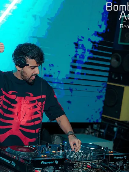 At the decks at Bombay Adda, wearing a skeleton t-shirt and bringing a hard-hitting vibe to the party.