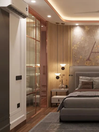 This angle highlights the glass-paneled wardrobe and the overall modern luxury theme of the bedroom design.