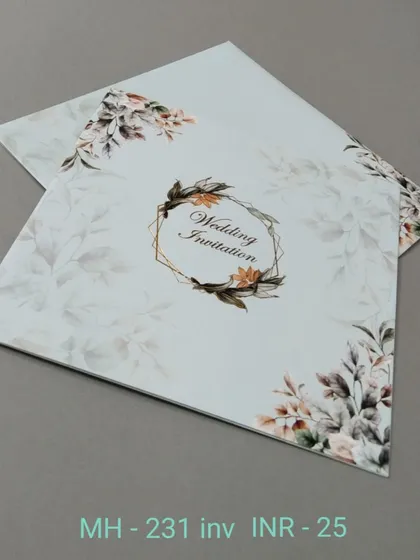 This modern invitation features a geometric frame decorated with a spray of autumn-colored leaves and flowers. It's a stylish and affordable option for a contemporary wedding.