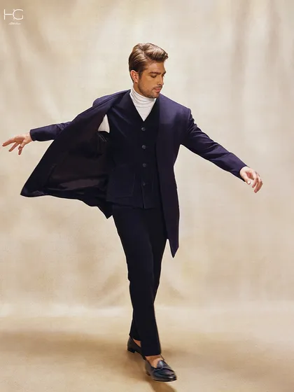 This look is a fresh take on texture. I styled a navy corduroy waistcoat and trench coat over a simple turtleneck for a layered look that exudes effortless sophistication.