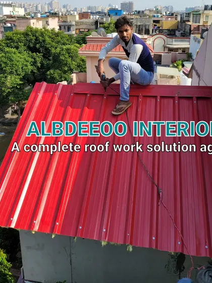 Our team installing a red metal roof. This adds a pop of color and is a durable, long-lasting roofing solution that we offer as a complete roof work agency.