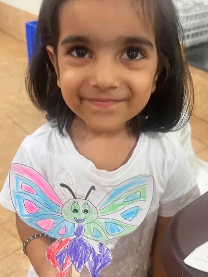 A beautifully colored butterfly puppet made by one of the children at our craft session. It's amazing to see their creativity shine.