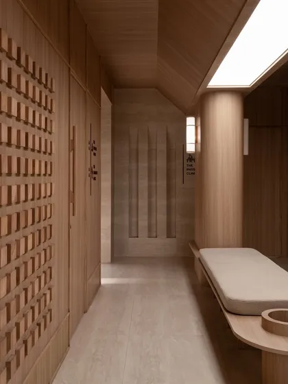 A detail of the corridor, focusing on the textured wooden wall panels and the integrated bench.